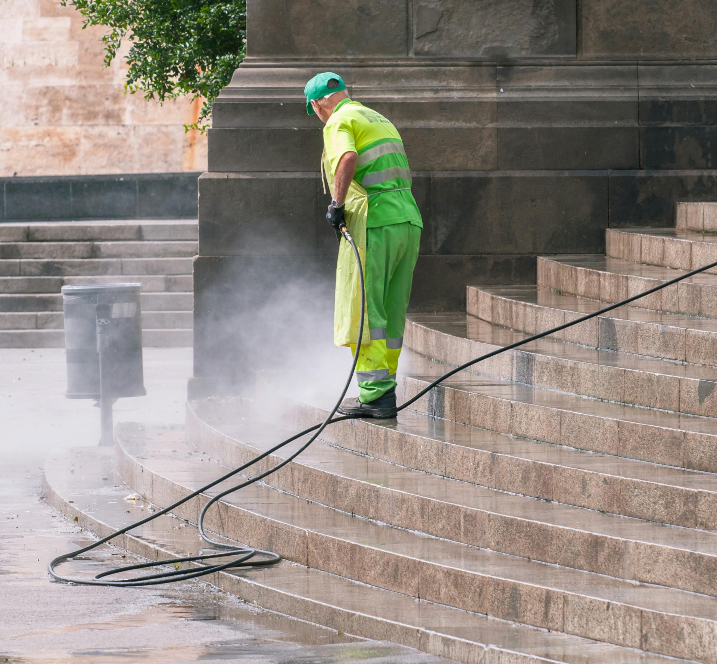 Driveway being cleaned with pressure washing