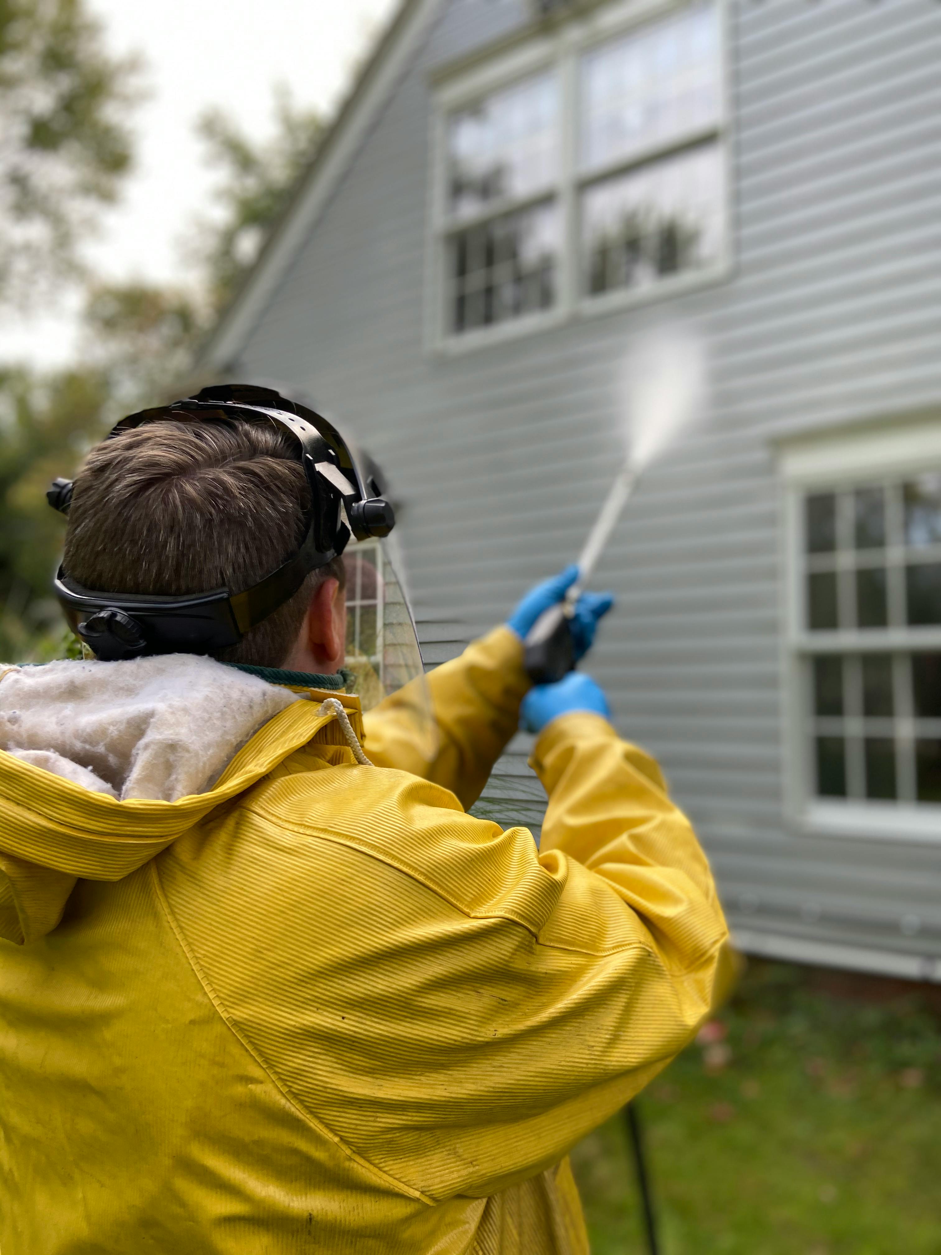 Freshly pressure washed home exterior with bright clean siding